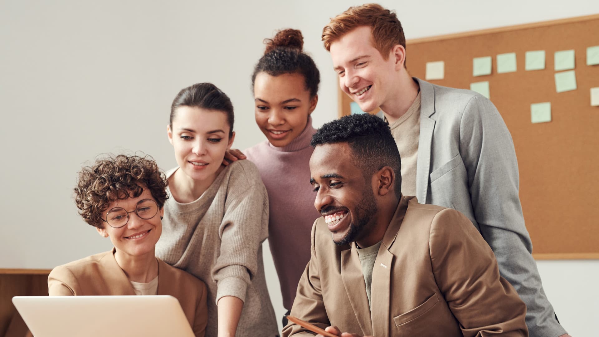 Photo Of People Looking On Laptop